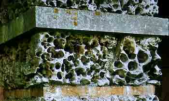 The vermiculated limestone of the portico