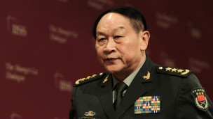 梁光烈在周日下午抵達印度孟買