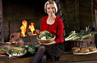 Lucy Worsley sits in a kitchen