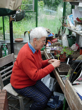 Joy in her greenhouse