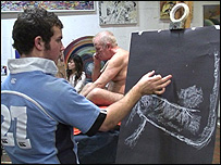 Young man drawing nude