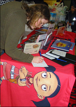 Woman requesting RaW storytelling pack at Asda