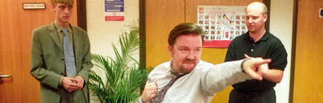 A fictional manager doing strange dance moves