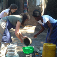 Gail and Vicky helping Abebu