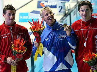 16/03/06: David Davies gasglodd medal gyntaf Cymru wrth gipio'r efydd yn y 400m dull rhydd yn y pwll nofio 