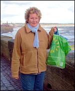 Mrs. Stockhill of Bridlington carrying rocks