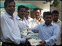 CM Pillayan collecting humanitarian aid