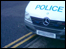 Police car parked on double yellow lines