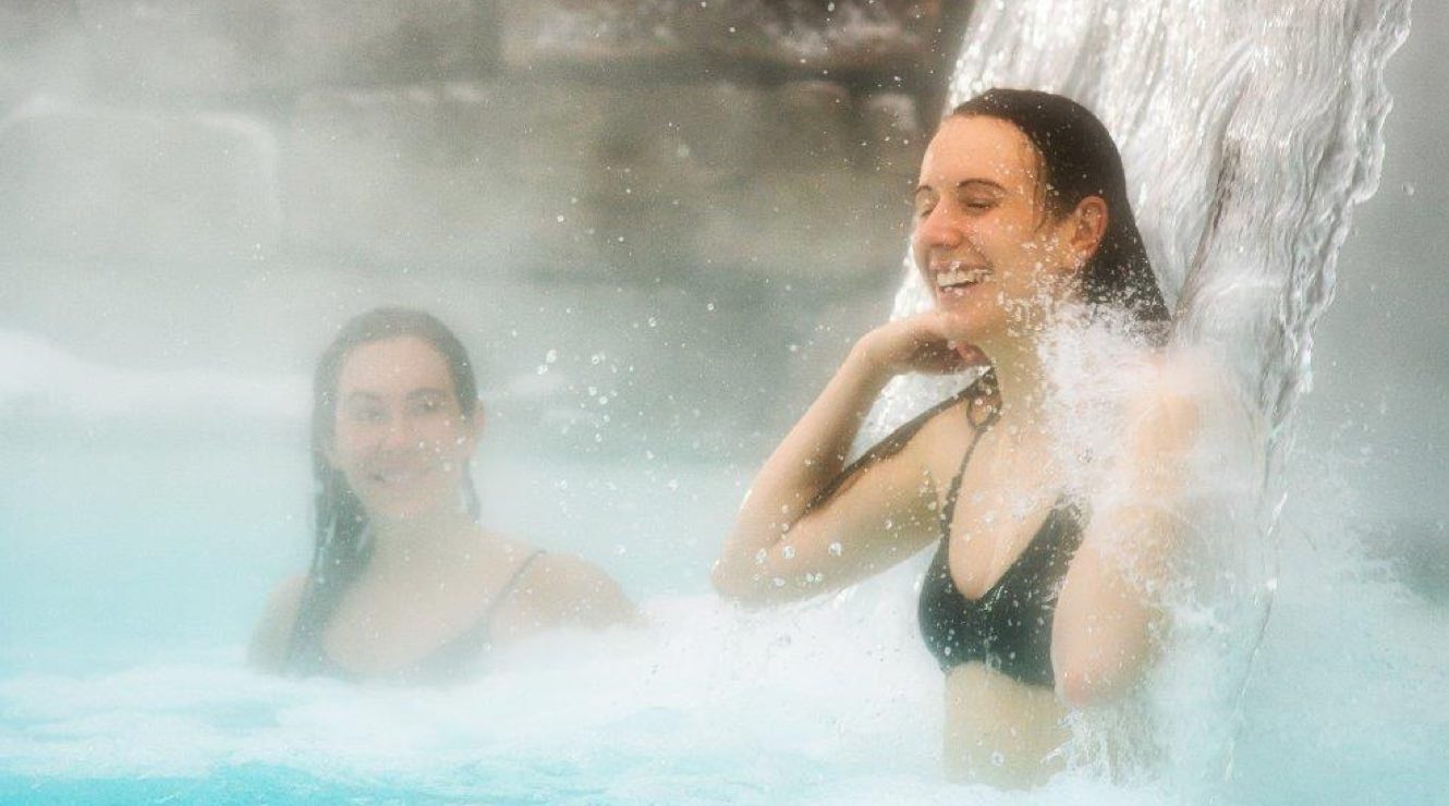 Friends enjoying a waterfall