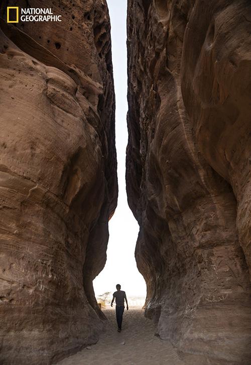 Salopek wanders through the ancient Nabataean ruins of Madain Salih, carved into sandstone outcrops some 2,000 years ago. Photo © John Stanmeyer/National Geographic